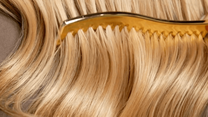 Hairburst Advanced+ supplement and shampoo on a bathroom shelf